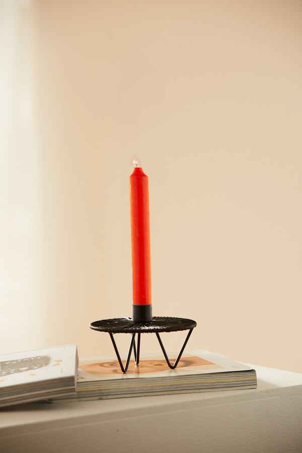 Orange elongated wax candle