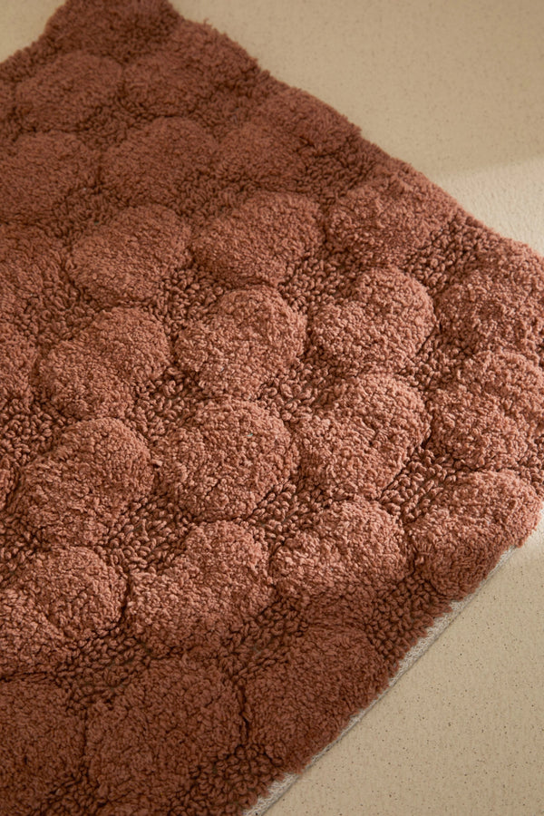 Alfombra de baño a cuadros en tono tierra Oslo