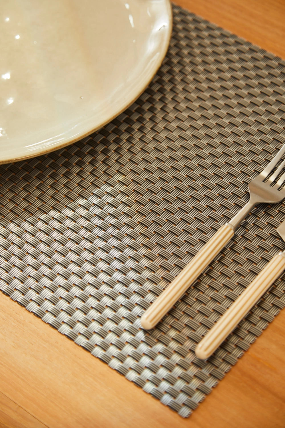 Mantel individual antimanchas trenzado negro Pla-Calma House